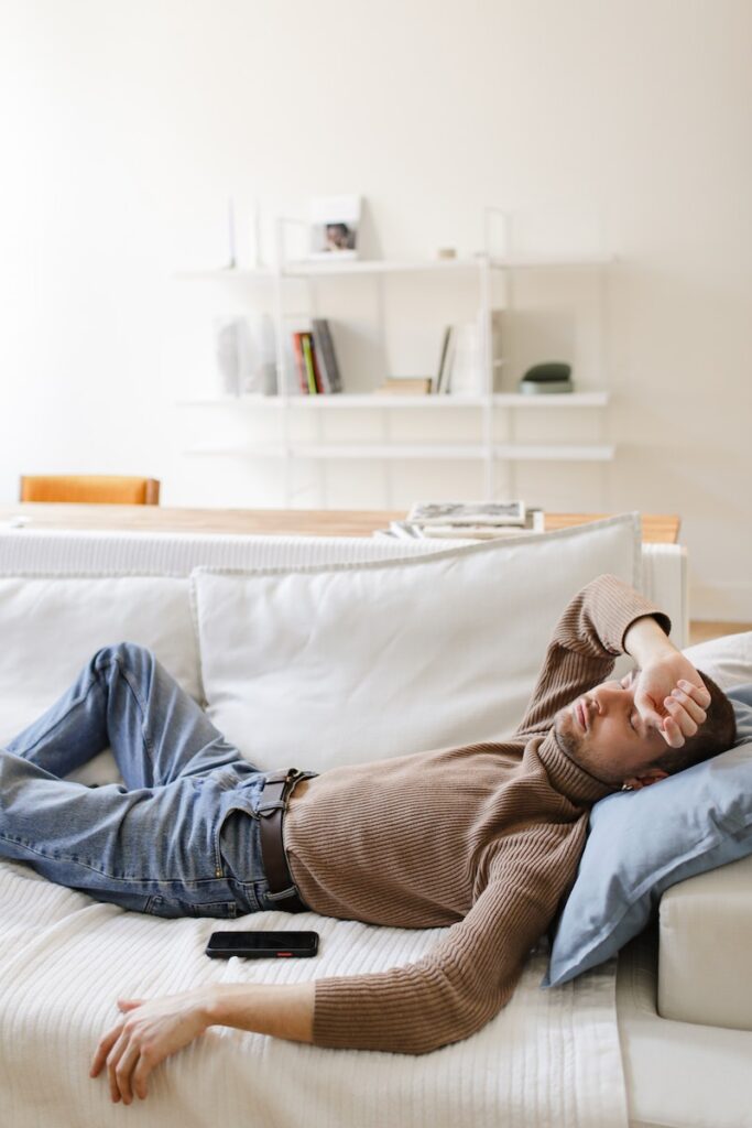 A Man Sleeping on a Sofa