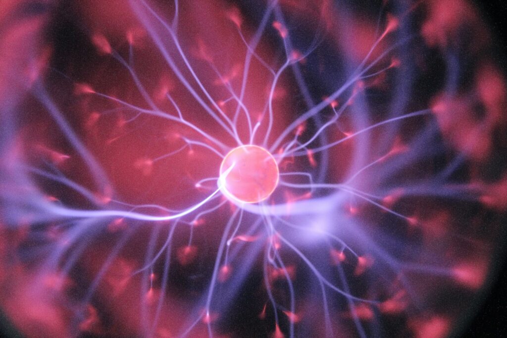 purple and pink plasma ball representing neurons in the science of chronic pain