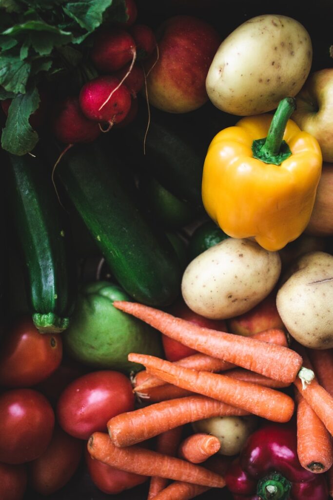 variety of vegetables close up - carrots, zucchini, peppers, and potatoes. 