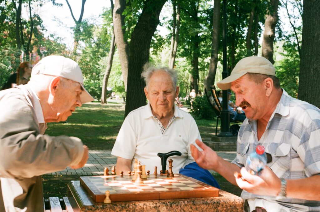 senior men playing chess